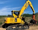 New Komatsu Swing Machine taking care of logs in forest,New Swing Machine lifting logs